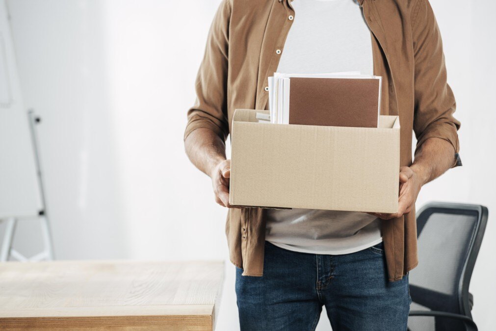close-up-hands-holding-box-with-stuff